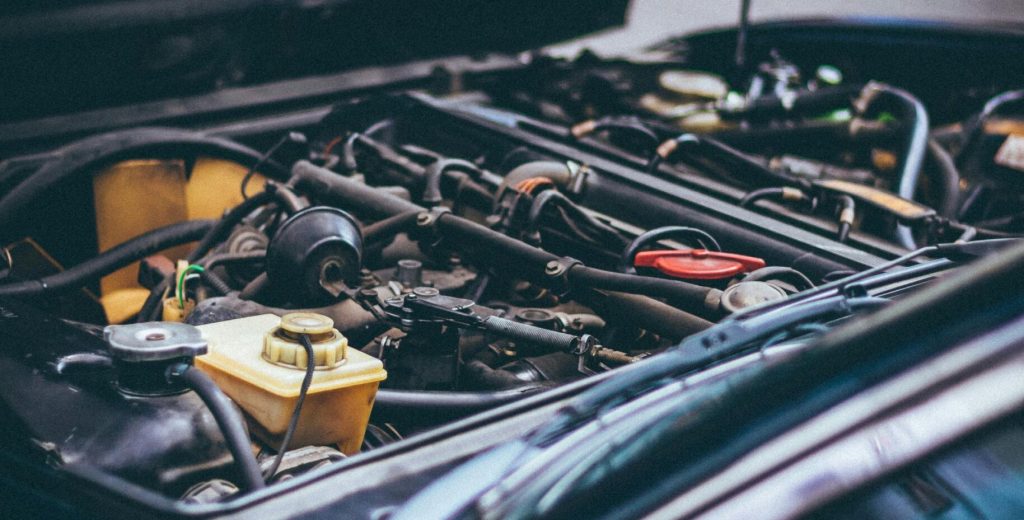 Detailed view of an exposed car engine under maintenance in Barcelona.